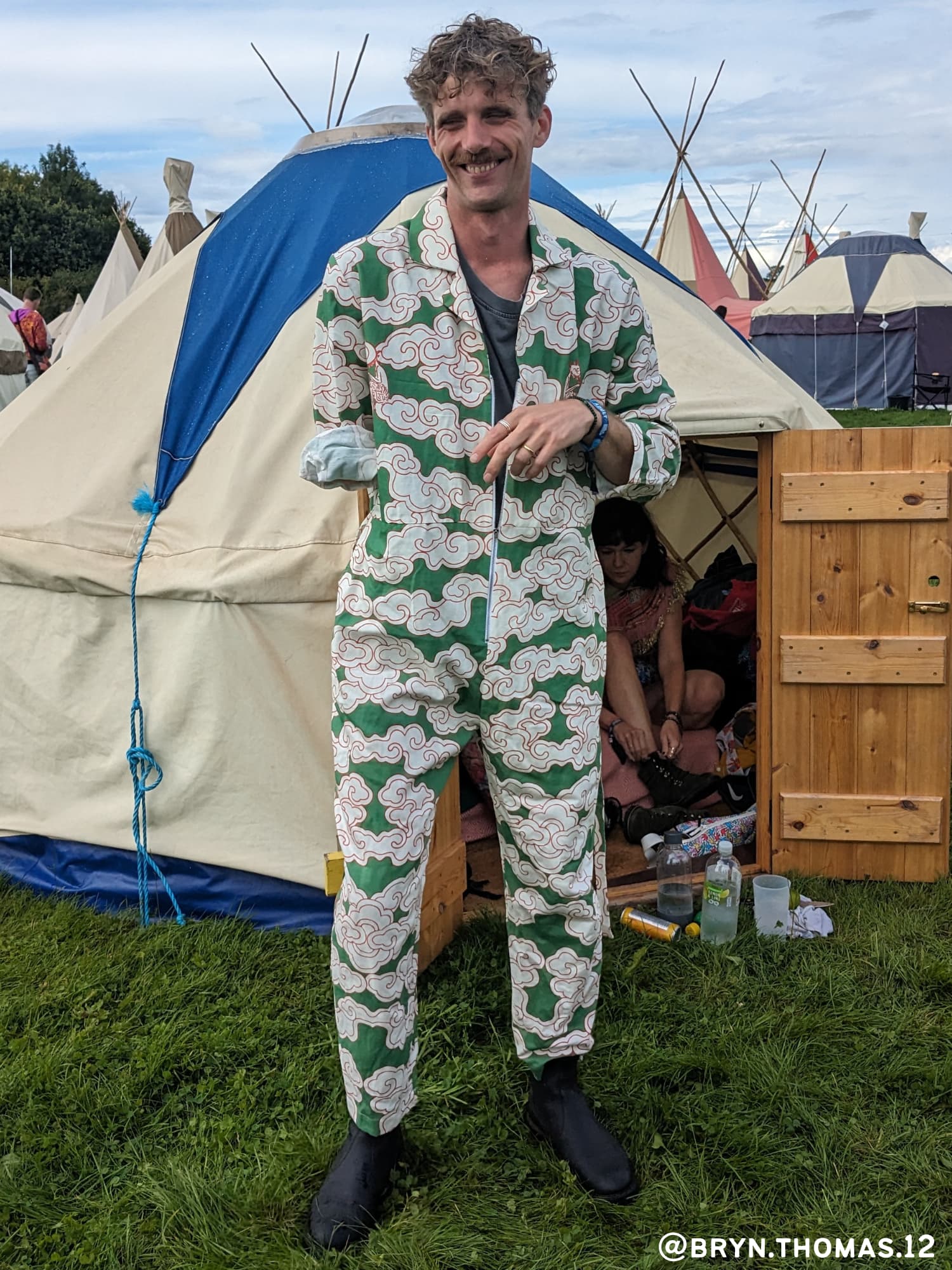 Man wears Green Clouds Jumpsuit by Wild Clouds at a festival
